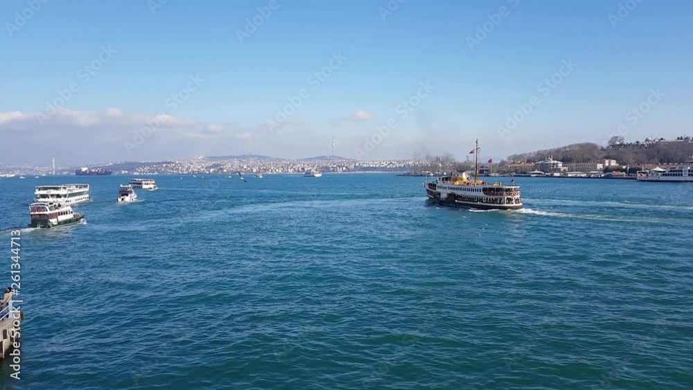 Passenger ships and boats cruising over Bosporus at sunny spring day Passenger ships and boats cruising over Bosporus at sunny spring day