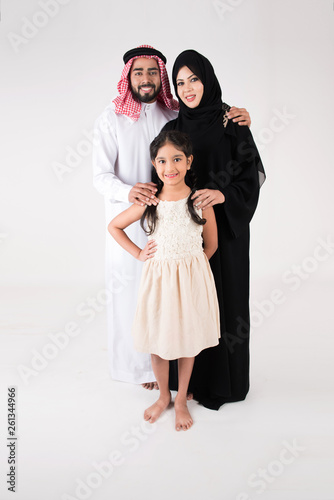 Arab family standing on white background © Mahmoud Rahall