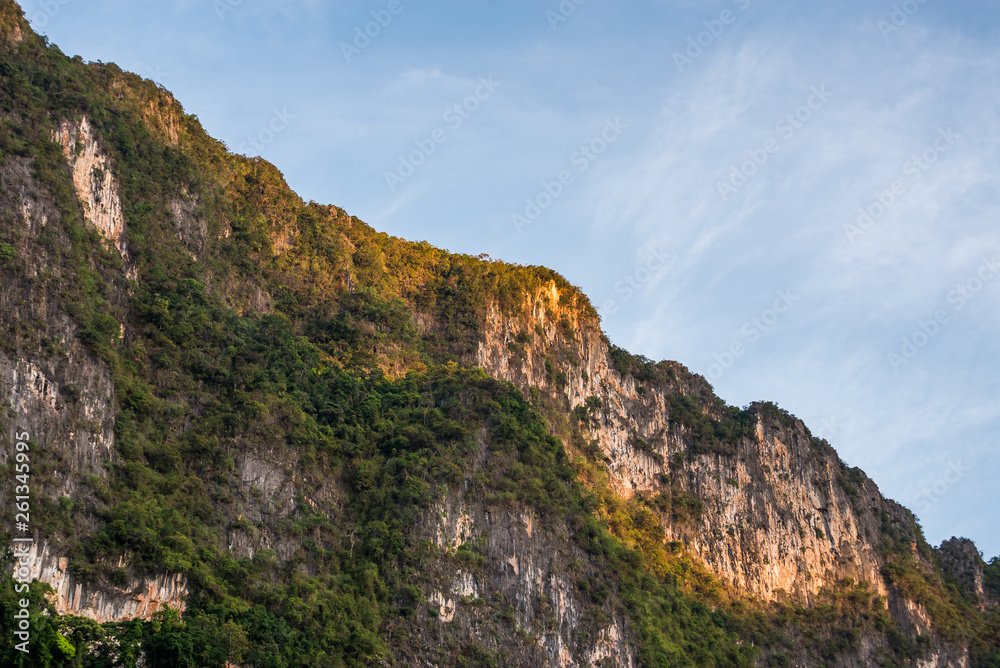 Beautiful nature rock mountains cliff with blue clear sky in Ratchaprapa Dam at Khao Sok National Park, Surat Thani Province, Thailand. Asia tourism location.