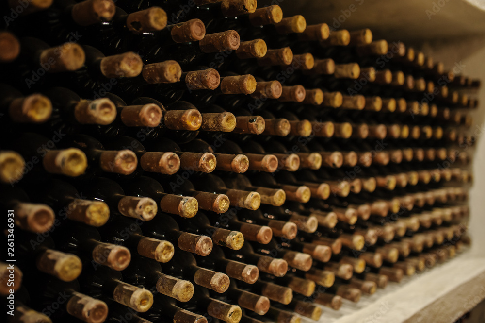 Wine bottles stacked up in old wine cellar Wine bottles stacked up in old wine cellar