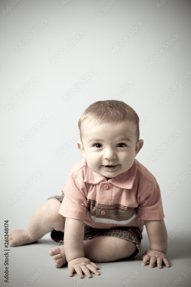 Happy Baby Boy Sitting Isolated - Desaturated Happy Baby Boy Sitting Isolated - Desaturated