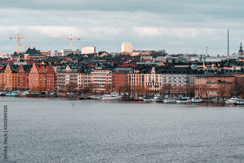 Fototapeta premium buildings at Norr Malarstrand at the coast of Stockholm city with boats at quay, Sweden