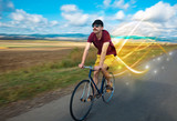 Young cyclist riding bicycle with magical landscape and concept