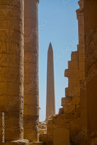 Luxor, Egypt: Columns and obelisk covered with hieroglyphs at the Temple of Amun at the Karnak Temple complex.