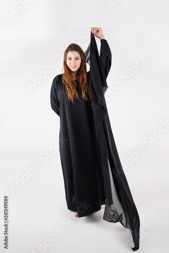 Beautiful Arab woman in traditional dress dancing