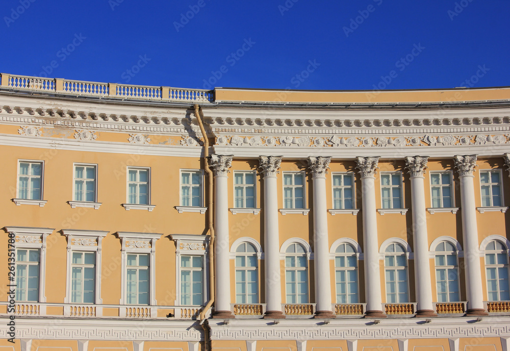 Building architecture of minimalist exterior details and simple symmetric windows in row with blue sky background