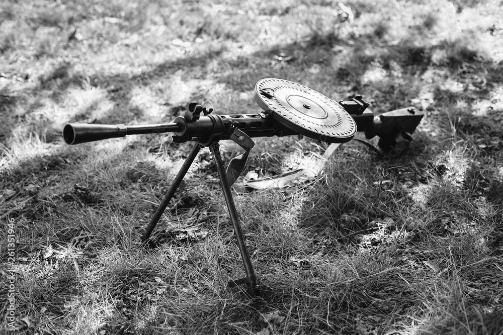 Foto de World War II Soviet Red Army Weapon. Degtyaryov DP Machine Gun On  Ground. WWII WW2 Russian Ammunition. Photo In Black And White Colors do  Stock