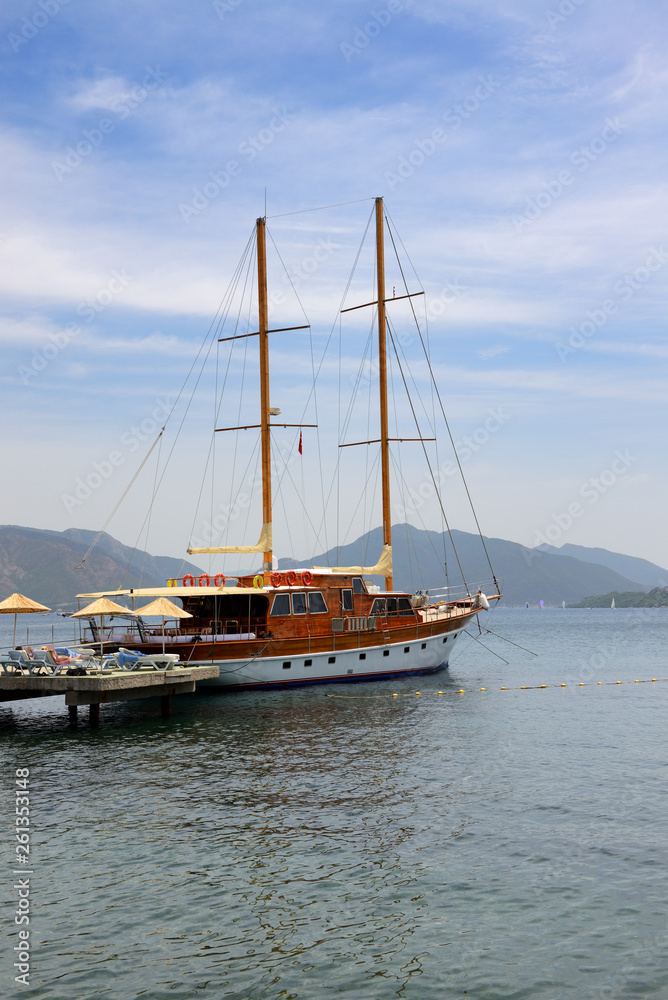 Sail yacht near beach on Turkish resort, Marmaris, Turkey
