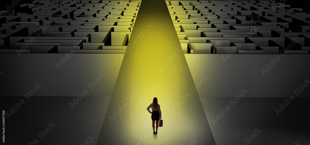Woman going straight ahead on a wide road between dark mazes
Woman going straight ahead on a wide road between dark mazes