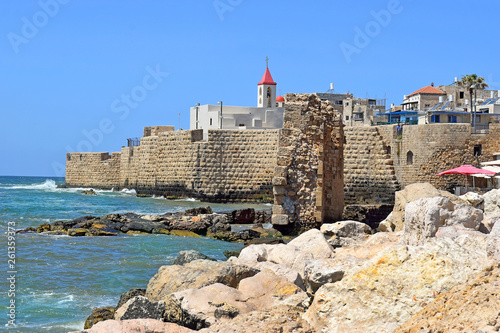 view of the fortress walls and St John's church, old city of Acre, Israel photo