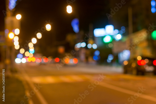 Bright circles from street lamps on defocused photo of night street. Highway, bokeh