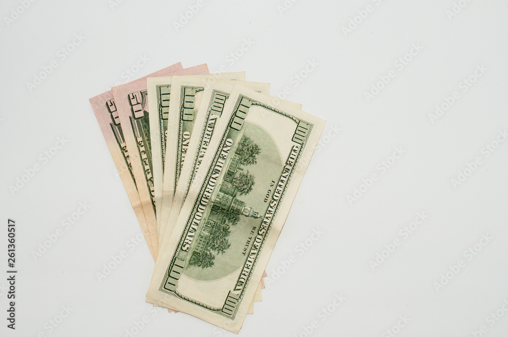 Money one hundred dollar bills close-up on a white background, isolate. Concept banking and finance Money one hundred dollar bills close-up on a white background, isolate. Concept banking and finance