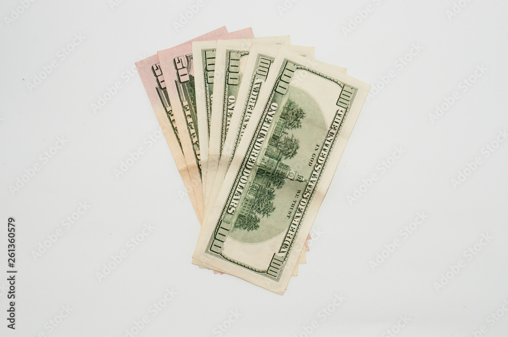 Money one hundred dollar bills close-up on a white background, isolate. Concept banking and finance Money one hundred dollar bills close-up on a white background, isolate. Concept banking and finance