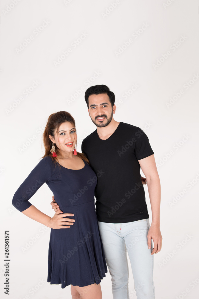 young couple together posing on white background young couple together posing on white background