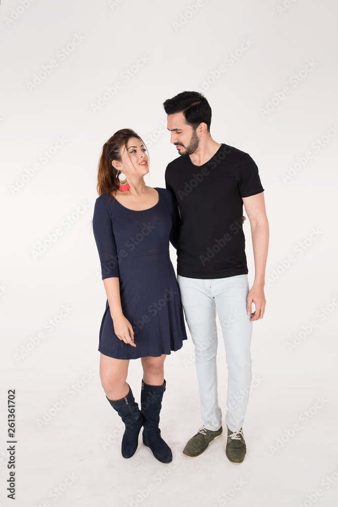 young couple together posing on white background young couple together posing on white background