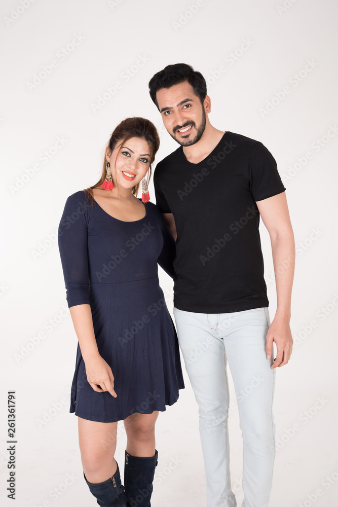 young couple together posing on white background young couple together posing on white background