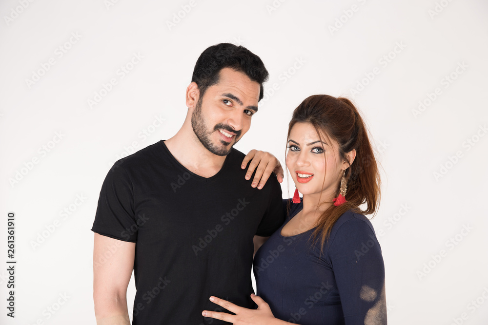 young couple together posing on white background young couple together posing on white background