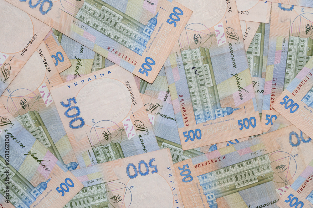 A lot of money, Ukrainian hryvnia, background of banknotes, view from the top. Shopping concept, banking and finance A lot of money, Ukrainian hryvnia, background of banknotes, view from the top. Shopping concept, banking and finance