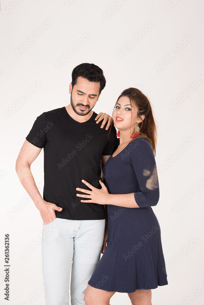 Fototapeta premium young couple together posing on white background