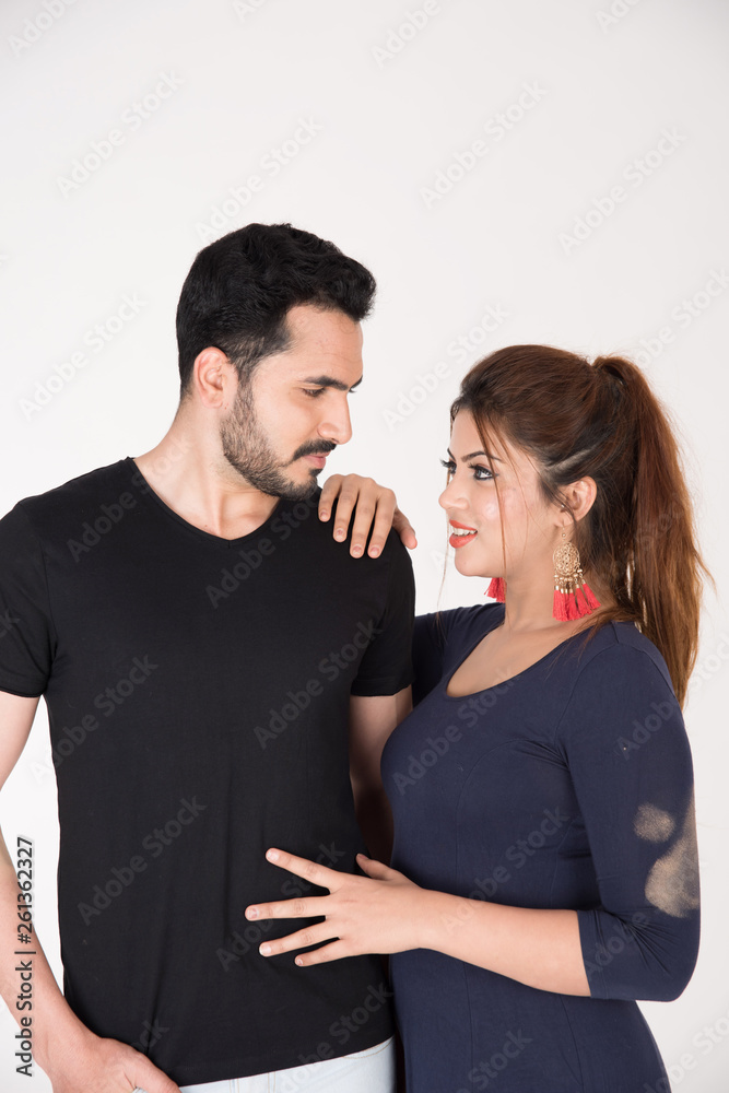 young couple together posing on white background young couple together posing on white background