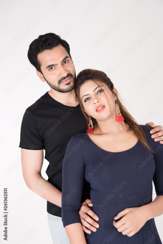 young couple together posing on white background young couple together posing on white background