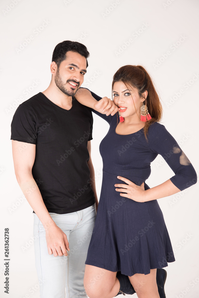 young couple together posing on white background young couple together posing on white background