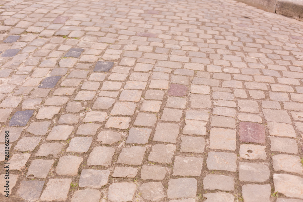 paving. the old road is made of stone. background texture stone walls paving. the old road is made of stone. background texture stone walls