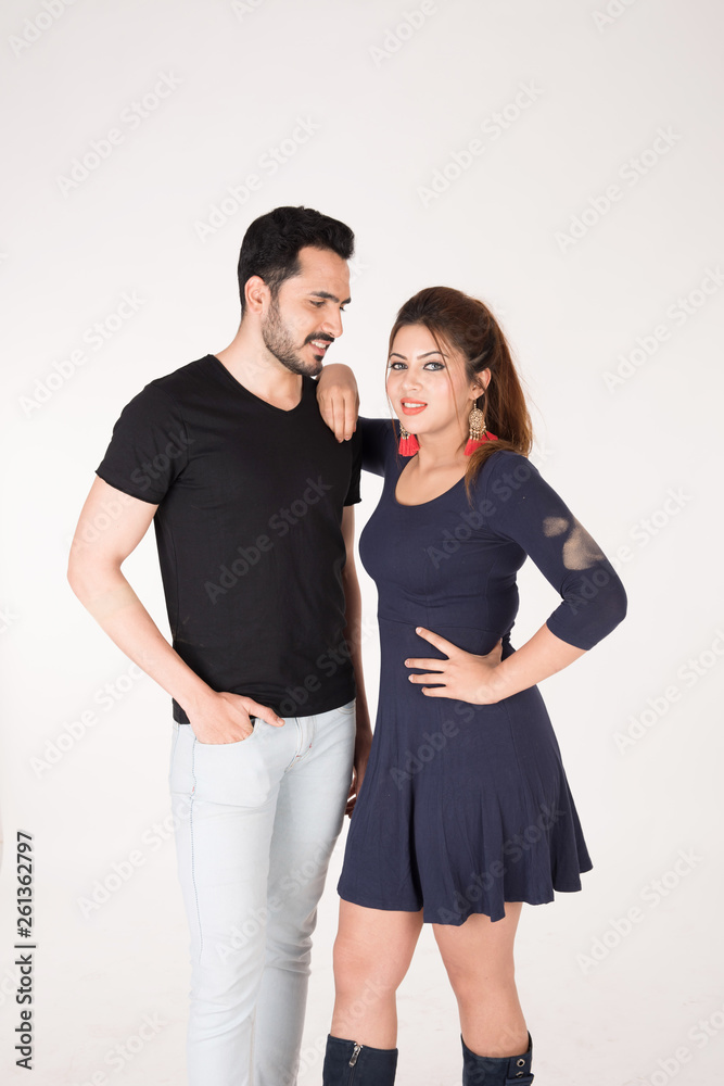 young couple together posing on white background young couple together posing on white background