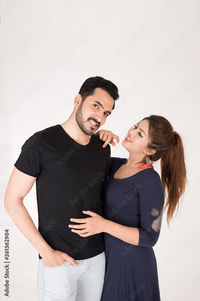 young couple together posing on white background young couple together posing on white background
