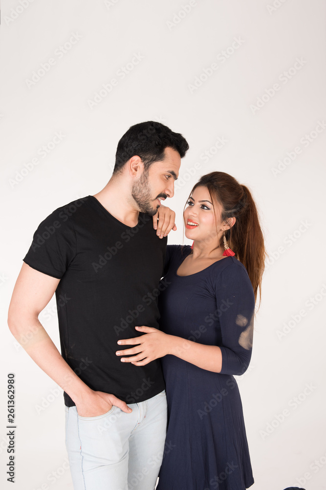 young couple together posing on white background young couple together posing on white background
