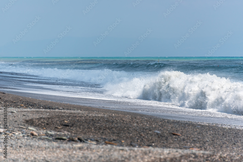 Volcanic Black Sand Beach and Blue Ionian Sea in Sicily Volcanic Black Sand Beach and Blue Ionian Sea in Sicily