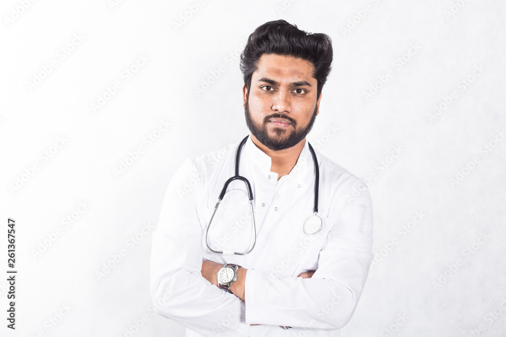 Handsome young doctor in a white coat with a stethoscope. Health care concept. Handsome young doctor in a white coat with a stethoscope. Health care concept.
