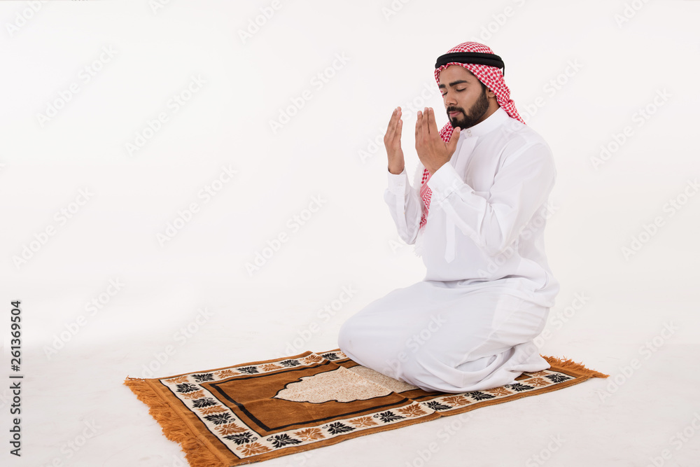 Fototapeta premium Muslim man praying on white Background