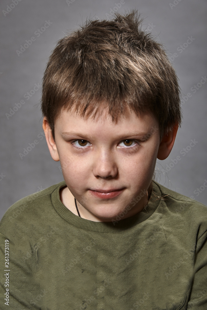 Photo of adorable young happy boy looking at camera. Photo of adorable young happy boy looking at camera.