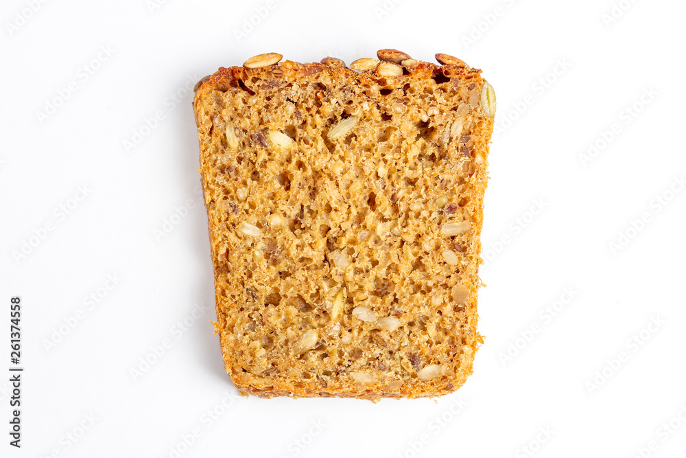 Slice of multigrain bread with sunflower and pumpkin seeds and flax seed on a white background Slice of multigrain bread with sunflower and pumpkin seeds and flax seed on a white background