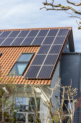 house with solar panels on rooftop
