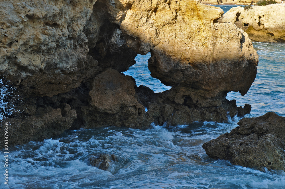 Idyllic sea, rocks and cliffs scenery in Aveiros Beach. Albufeira, Algarve, Portugal