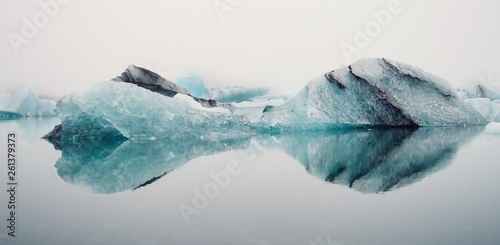 Winter landscape with icebergs reflecting in water, Iceland