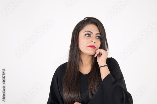 Arab woman in traditional dress on white background