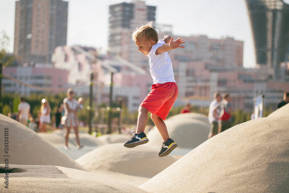 Fototapeta premium Boy jumping on trampoline
