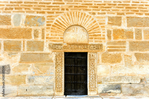 Old door in wall in Kairouan , Tunisia.