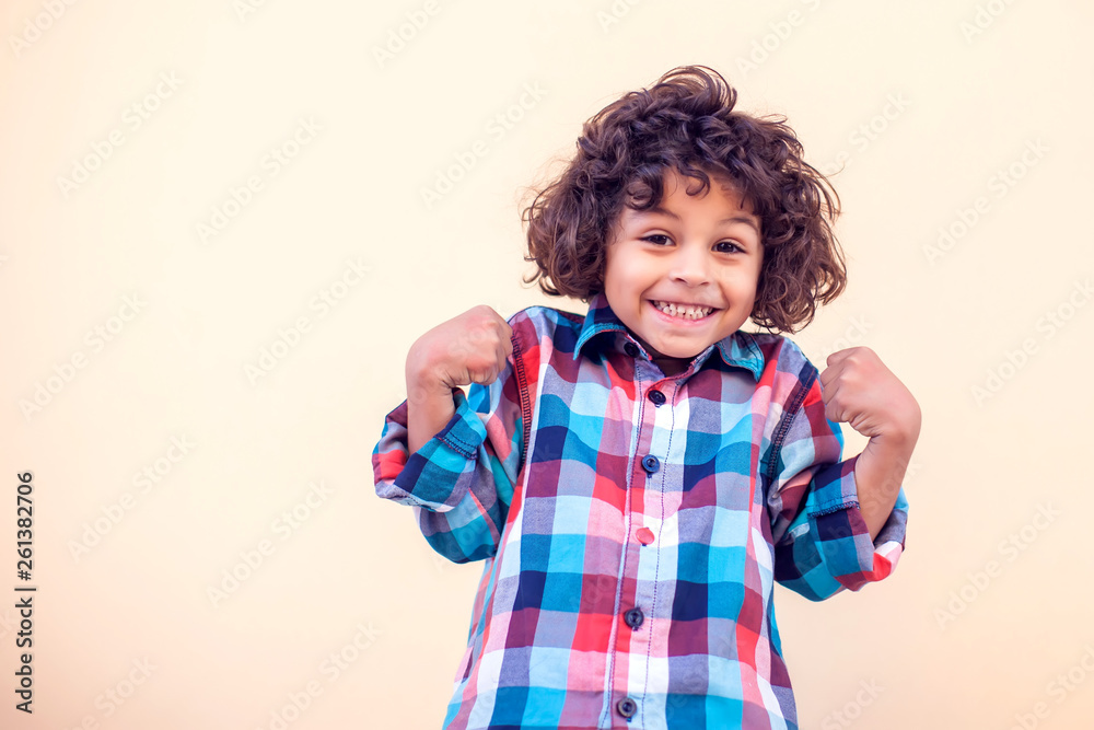 Portrait of happy joyful laughing little boy with curly hair Portrait of happy joyful laughing little boy with curly hair