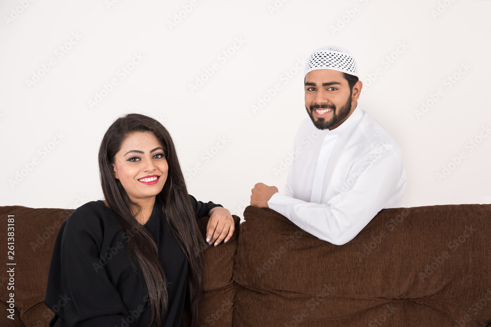 Arab couple sitting at home Arab couple sitting at home