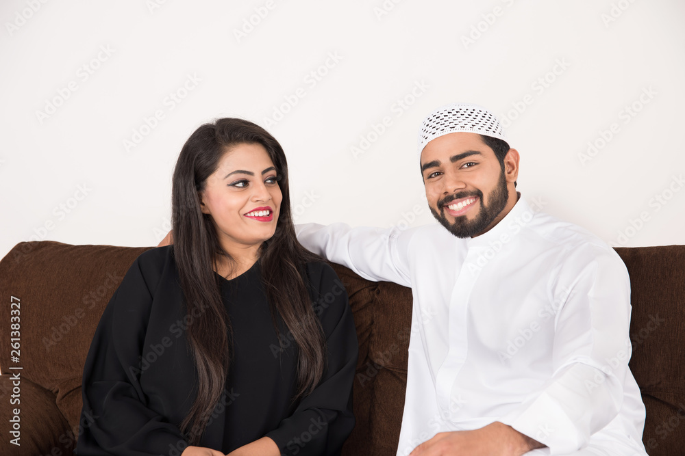 Arab couple sitting at home Arab couple sitting at home