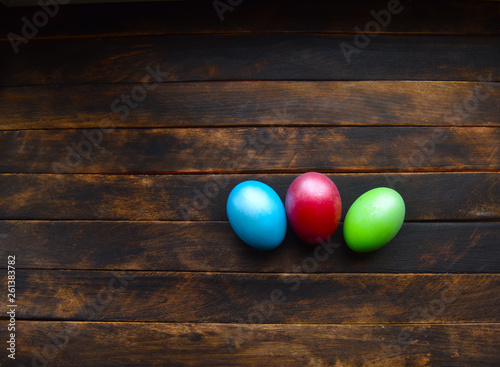 painted Easter eggs on wooden background