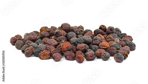 Dried medicinal herbs raw materials isolated on white. Fruit of Crataegus commonly called hawthorn, thornapple, May-tree, whitethorn, or hawberry. Cure for the heart. medicine in a cup of tea.