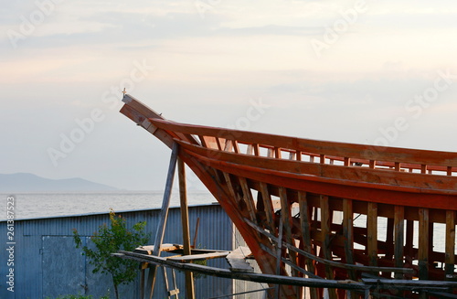 Construction of a ship in Ierissos, Greece. Little shipyard of wooden ships. photo