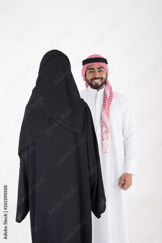 arab couple smiling and standing on white background arab couple smiling and standing on white background
