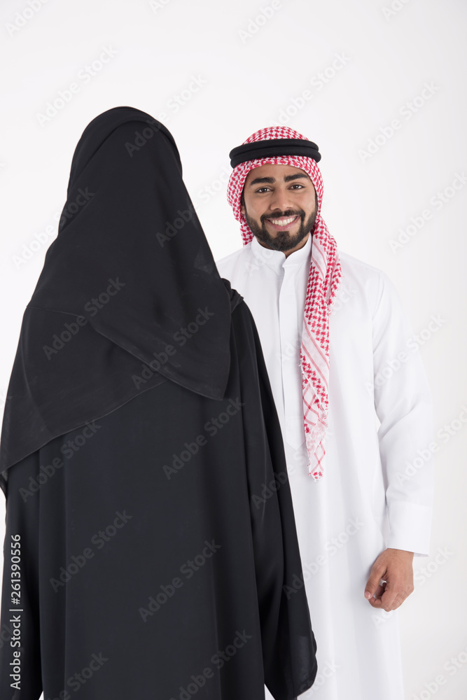 arab couple smiling and standing on white background arab couple smiling and standing on white background