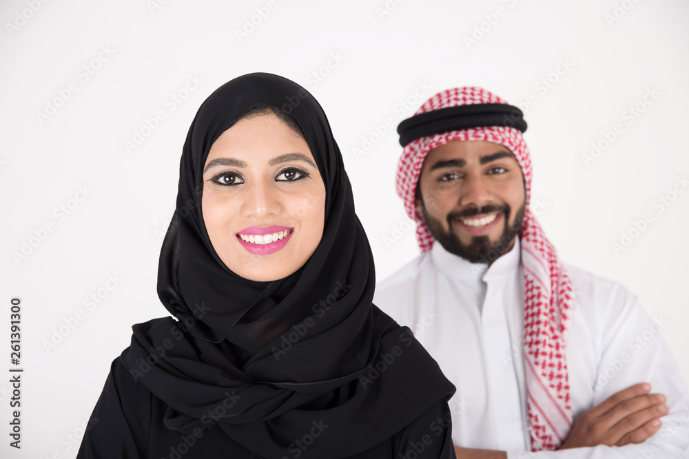 arab couple smiling and standing on white background